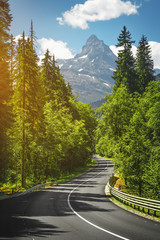mountain road. travel through woodland to icepeaks. © tarasov_vl