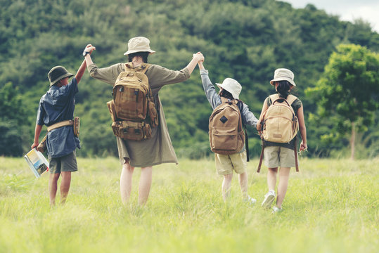 Group Asian Family Children Checking Map In The Jungle Adventure And Tourism For Destination And Leisure Trips For Explore Education And Relax In Nature Park.  Travel Vacations Concept