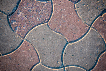 Texture of paving slabs overgrown with grass. Background image of a stratum stone