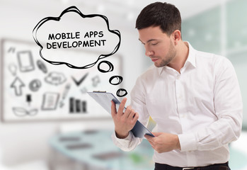 Business, technology, internet and network concept. The young businessman comes to mind the keyword: Mobile apps development
