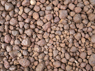 Texture of brown pebbles stone  from waterfall.