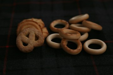 Sand dough cakes and cookies on a dark background