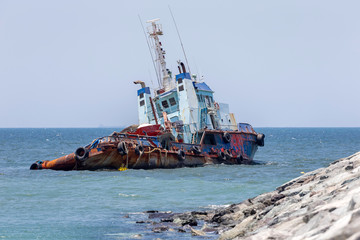 Abandoned cargo ship in the sea