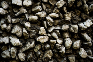 Texture photo of rough concrete plaster with sprinkled gravel