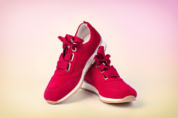 modern red and white woman's shoes isolated on color background