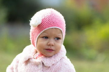 Little girl in the autumn park