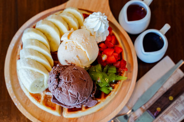 dessert made of brownie and green tea ice cream together with whipped cream on the white plate