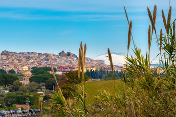 Naklejka premium Cityscape of Mazzarino with the Mount Etna in the Background, Caltanissetta, Sicily, Italy, Europe