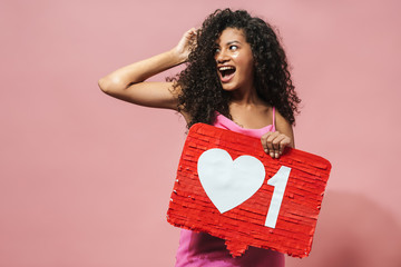Image of funny african american woman holding placard and laughing