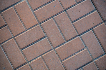 Texture of paving slabs overgrown with grass. Background image of a stratum stone
