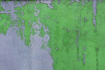 Old green cracket painted wall with grey colors
