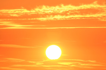 Fototapeta premium Sunrise sunset in the sky with selective focus on the sun