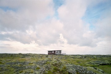 Shack in rugged landscape