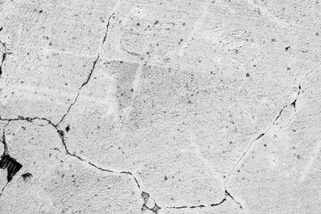 Texture of a concrete wall with cracks and scratches which can be used as a background