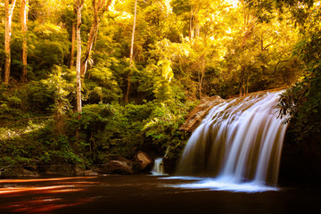Beautiful waterfall with sunlight in jungle, Haew Suwat Waterfall