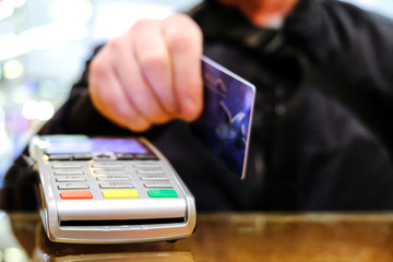 Buying groceries in a hypermarket. Credit card payment.
