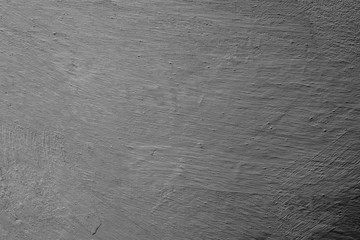 Texture of a concrete wall with cracks and scratches which can be used as a background