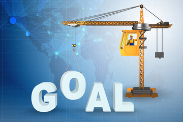 Crane lifting the word goal up