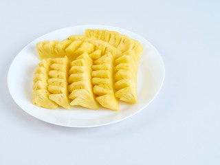 Pineapple slices in white plate
