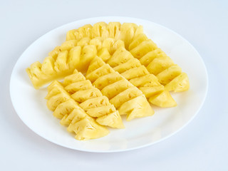 Pineapple slices in white plate