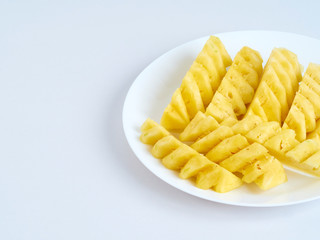 Pineapple slices in white plate