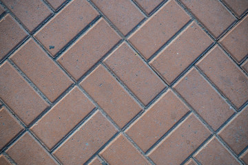 Texture of paving slabs overgrown with grass. Background image of a stratum stone