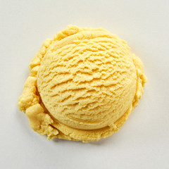 Scoop of yellow ice cream in close-up