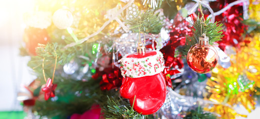 Blurry of Christmas and New Year's balls with beautiful decorations on the Christmas tree, soft light, beautiful background images and illustrations.