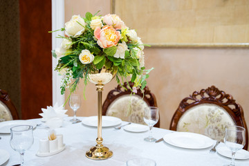 Flower arrangement of artificial, natural flowers