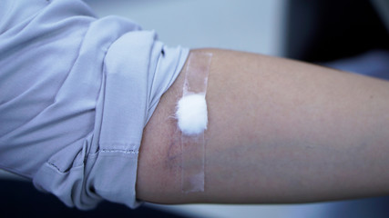 doctor injecting with syringe to patient's arm drawing blood sample for blood test in hospital. 24 Nov 2019 Bangkok Thailand.    