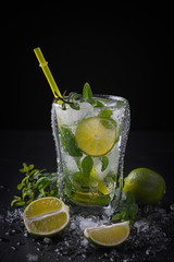 Mojito cocktail in a bur on a rustic table