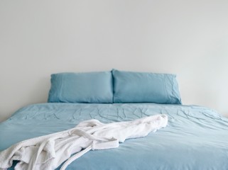 Bathrobe On Blue Bed