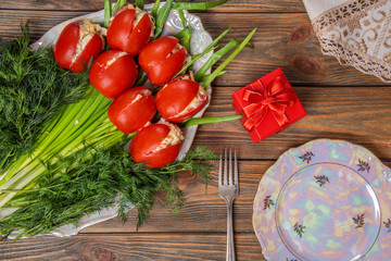 Salad stuffed tomatoes. Original holiday salad. Festive table setting.