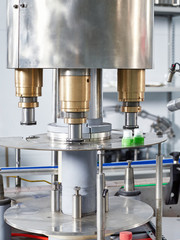 Closeup of industrial equipment for the manufacture of plastic caps