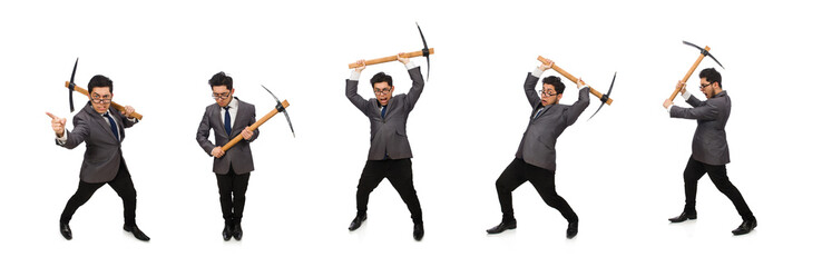 Young businessman holding a tool isolated on white