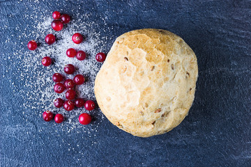 Homebaked bread. Cranberries in sugar and bun. Directly above.