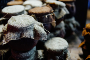 Vintage clay pots of jam and honey
