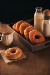 Sugar donuts with a glass of milk