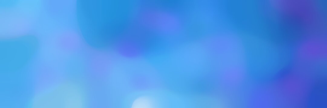 blurred bokeh horizontal background with corn flower blue, royal blue and light sky blue colors and free text space