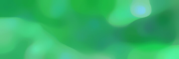 blurred horizontal background with medium sea green, medium aqua marine and sea green colors and space for text