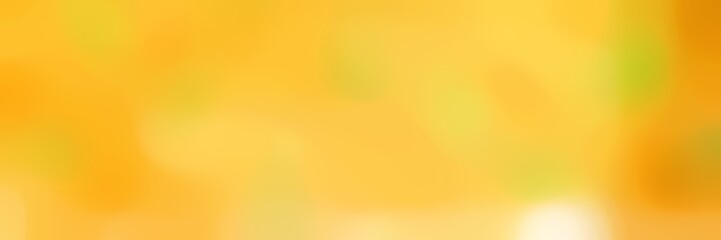 blurred bokeh horizontal background with pastel orange, golden rod and vivid orange colors and space for text