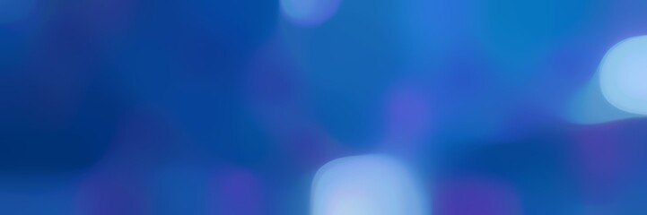 blurred bokeh horizontal background with strong blue, sky blue and royal blue colors and space for text