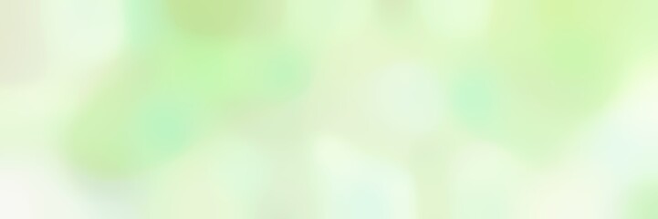 blurred horizontal background with tea green, beige and honeydew colors and space for text