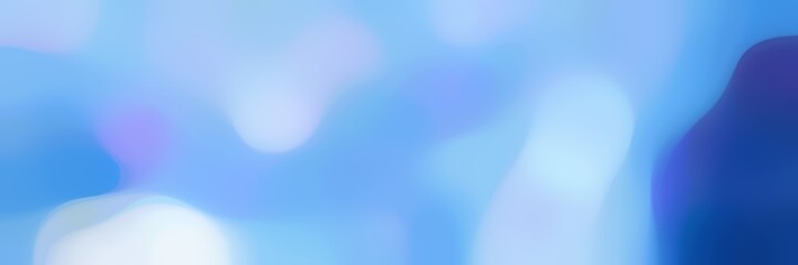 blurred bokeh horizontal background with light sky blue, strong blue and corn flower blue colors and free text space