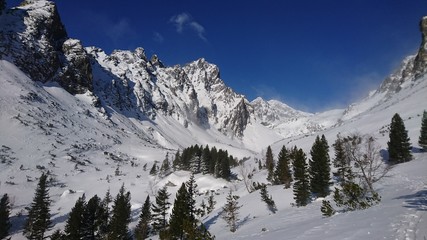 Sunny winter day in the high mountains Snow covered landscape deep blue sky sunshine High Tatras Europe Alps