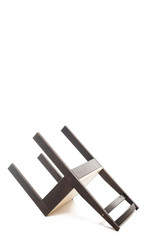 Inverted brown wooden chair isolated on white