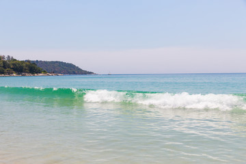 Beach scene, calm summer nature landscape. Blue sky and ocean waves