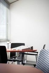 Binder And Water Glass On Office Table