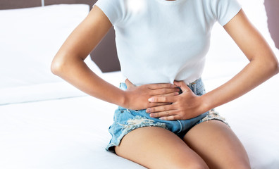 woman Hands holding belly Abdominal pain bowel health Problems