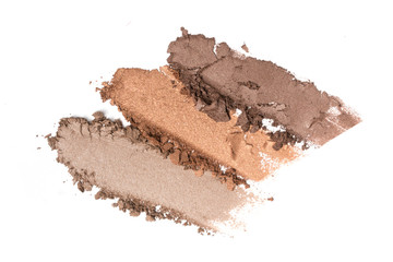 Smear of shiny brown eyeshadow isolated on white